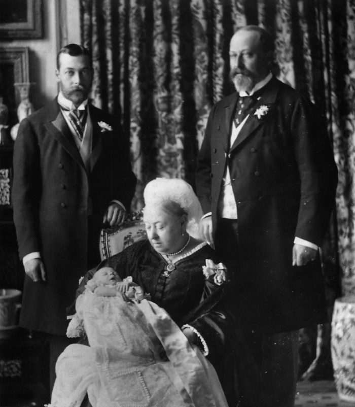 Photo of Queen Victoria with the future Kings Edward VII (right) and George V (left), then Duke of York and his baby son, the future Edward VIII