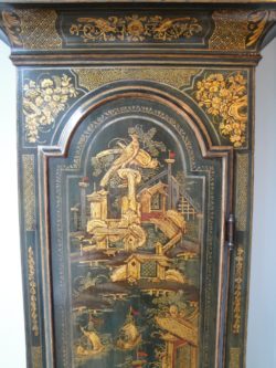 Detail of Chinoiserie lacquer decoration on a longcase clock by Monkhouse.