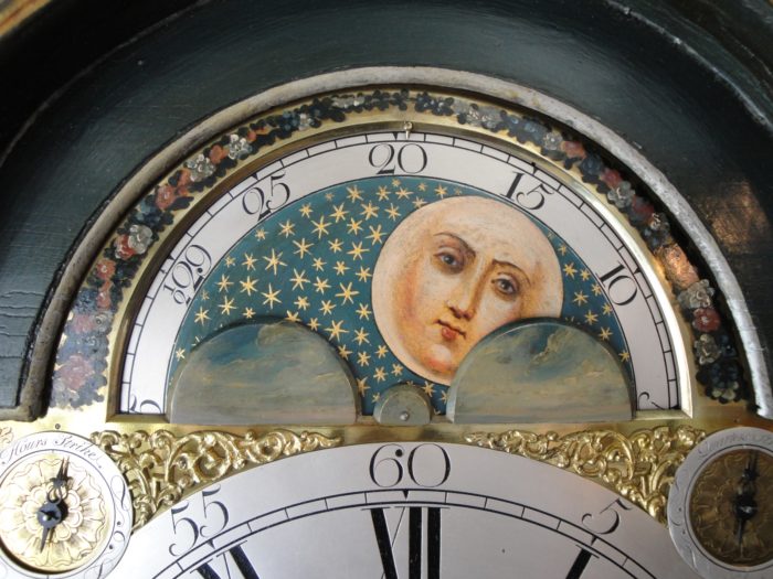 Detail of a clockface with moon phase. Raffety Antique Clocks