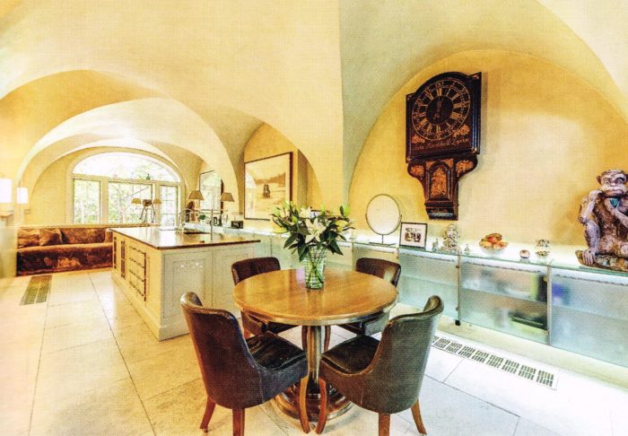 Modern kitchen interior with a prominent tavern clock on display.