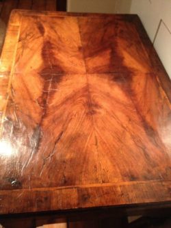 Detail of the figured walnut top with crossbanding on a George I period lowboy. Circa 1725. Raffety Ltd