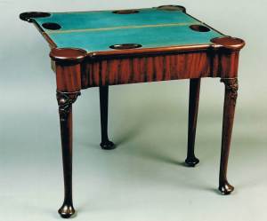 Detail of the mahogany games table, showing the baize covered card table. Circa 1740. Raffety Ltd.