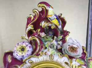 Detail of flowers and bird on the clock by Vulliamy, London.