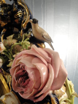 Detail of bird and naturalistic handcrafted and handpainted rose.