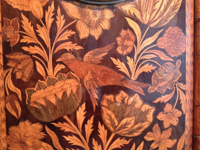 Detail of marquetry decoration on longcase clock by Carolus Cabrier, with bird and flowers. Raffety Ltd