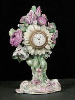 Sunflower and posy shaped clock case.